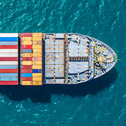 Aerial of container ship at sea.