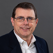 Portrait of Cary Knuth smiling.