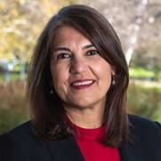Portrait of Mitra Kashanchi smiling.