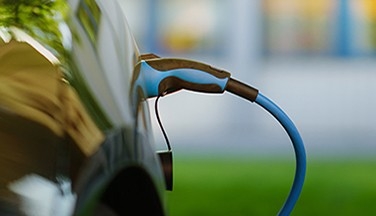 Electric vehicle being charged