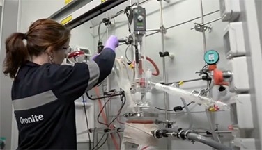 Woman conducting tests in a lab.